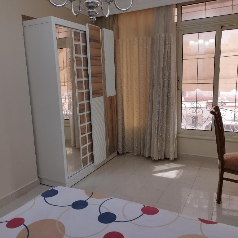 Postel nebo postele na pokoji v ubytování Apartment Nasr City
