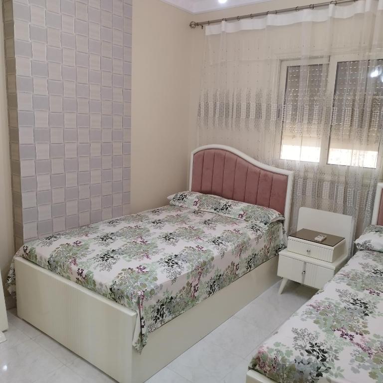 Postel nebo postele na pokoji v ubytování Apartment Nasr City