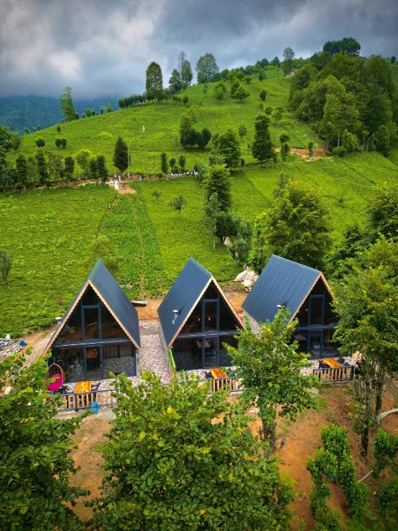 an aerial view of a house on a hill at Doğallife suit bungalow in Çamlıhemşin