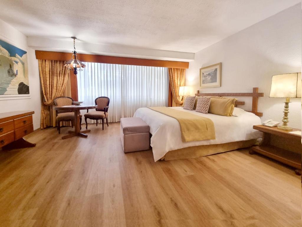 Postel nebo postele na pokoji v ubytování Antara Hotel & Suites - Miraflores