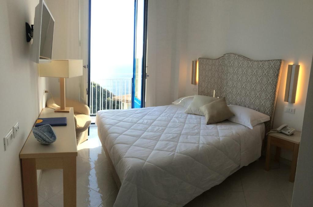 Postel nebo postele na pokoji v ubytování Boutique Hotel Helios
