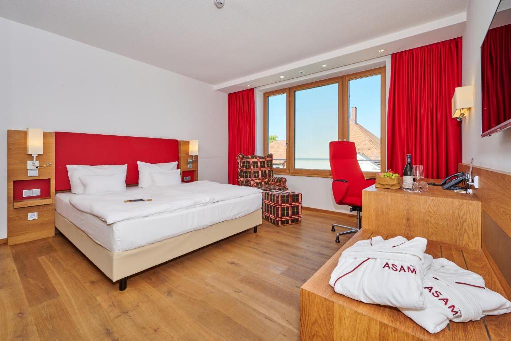 Postel nebo postele na pokoji v ubytování Asam Hotel