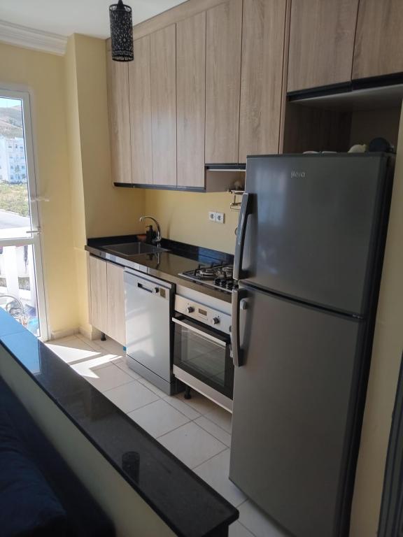Kuchyň nebo kuchyňský kout v ubytování Appartement bien équipé à 5 min de la plage, TOUT INCLU!