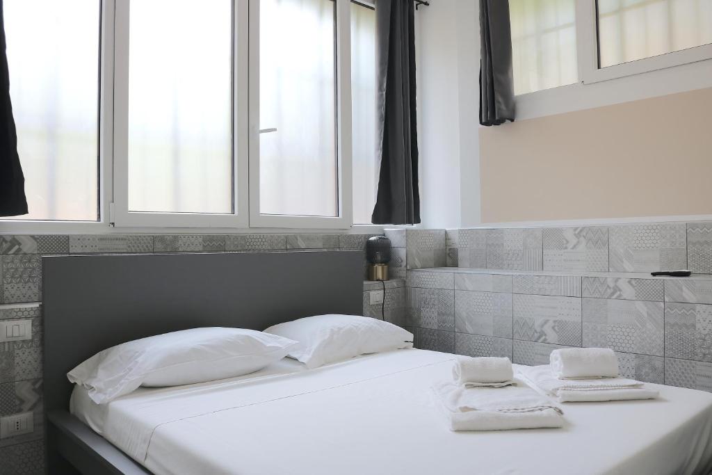 Postel nebo postele na pokoji v ubytování Gambara GuestS House
