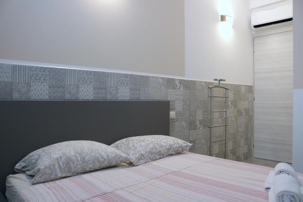 Postel nebo postele na pokoji v ubytování Gambara GuestS House