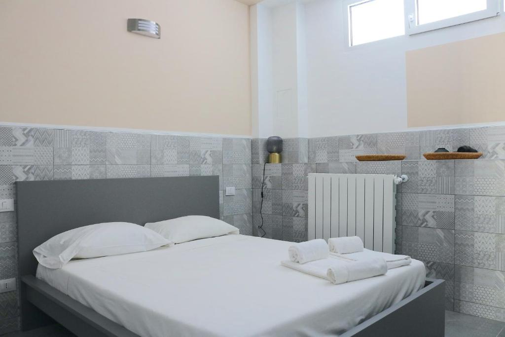 Postel nebo postele na pokoji v ubytování Gambara GuestS House