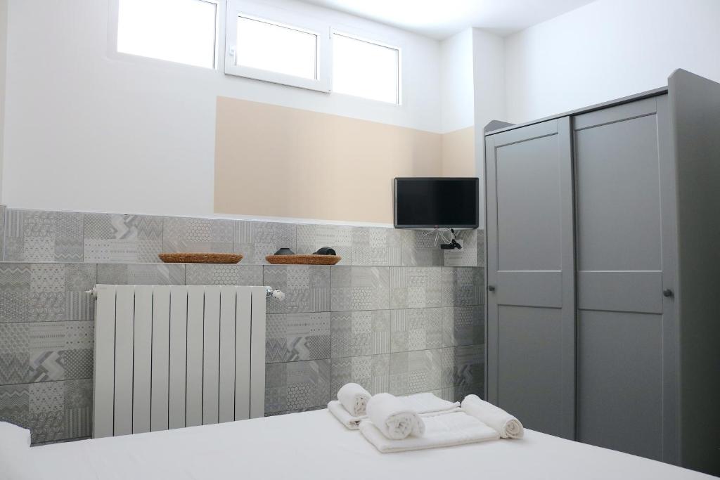 Postel nebo postele na pokoji v ubytování Gambara GuestS House