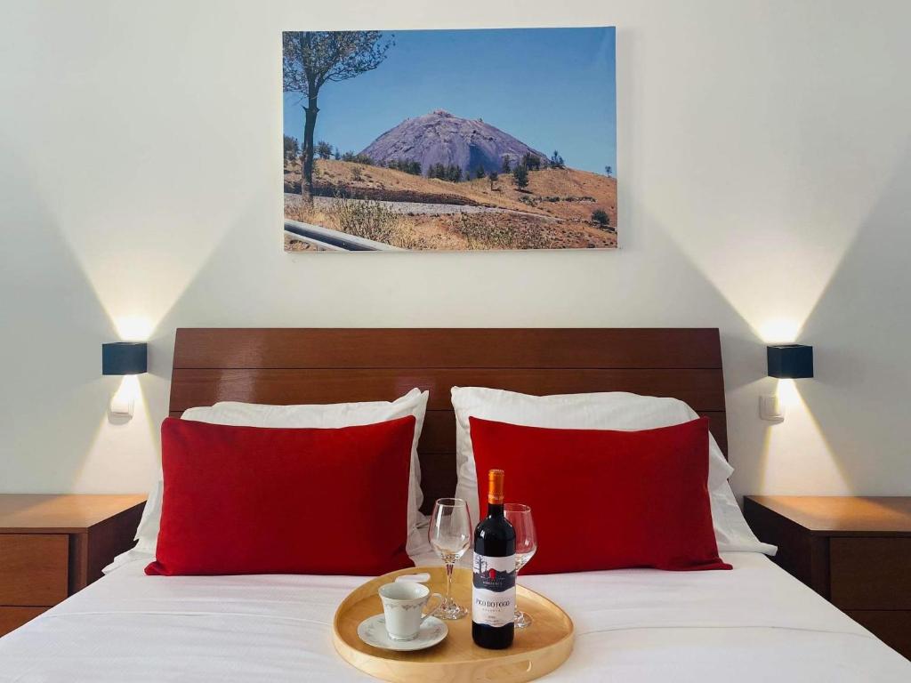 Postel nebo postele na pokoji v ubytování Fogo Boutique Hotel