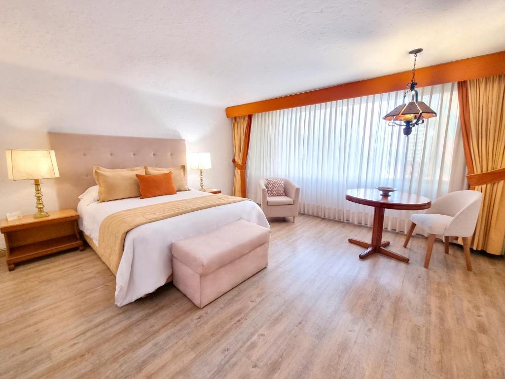 Postel nebo postele na pokoji v ubytování Antara Hotel & Suites - Miraflores