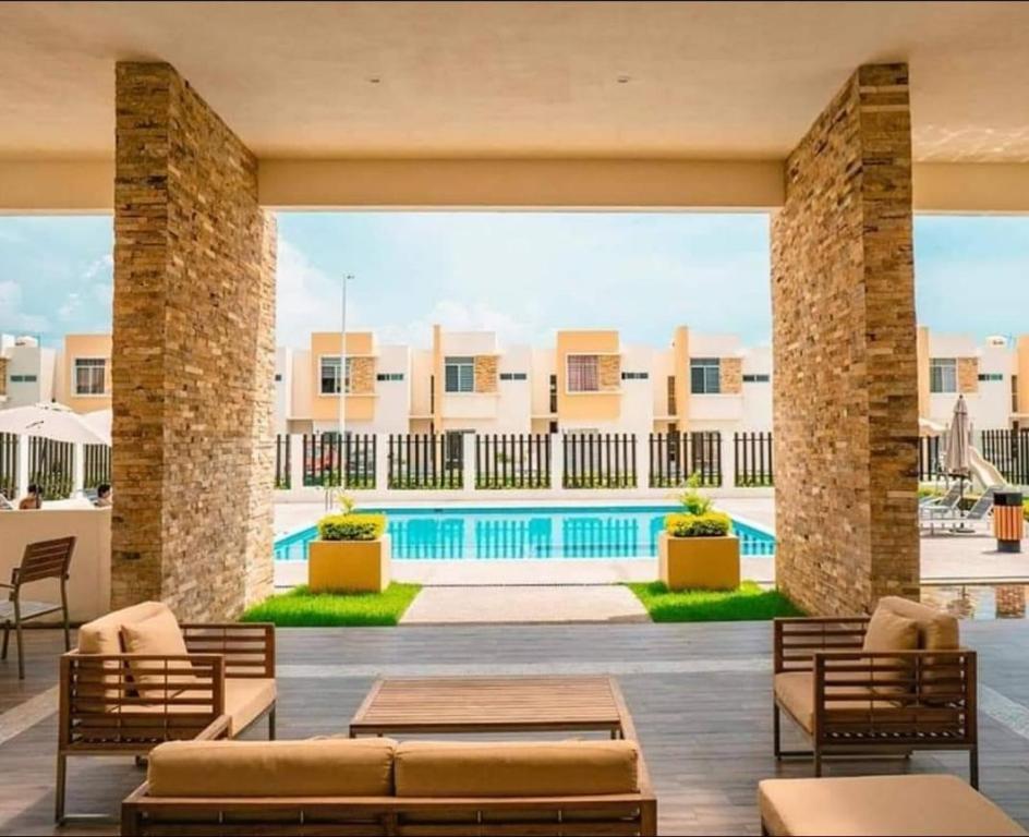 a view of a pool at a resort at Hermosa Casa en Residencial El Roble in Nuevo Vallarta 