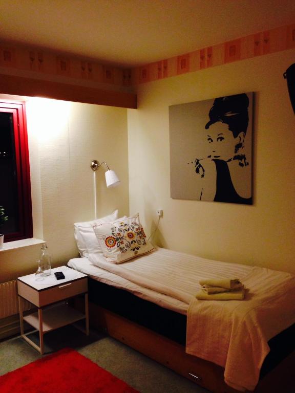 Postel nebo postele na pokoji v ubytování Kils Hotell & Restaurang