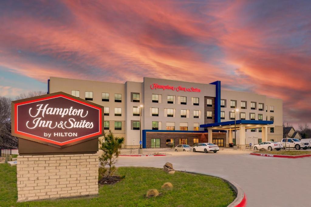 a large building with a sign in front of it at Hampton Inn & Suites Weatherford, Tx in Weatherford