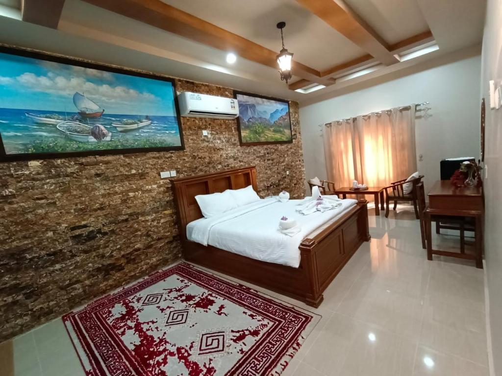 Postel nebo postele na pokoji v ubytování Durrat Nizwa Inn