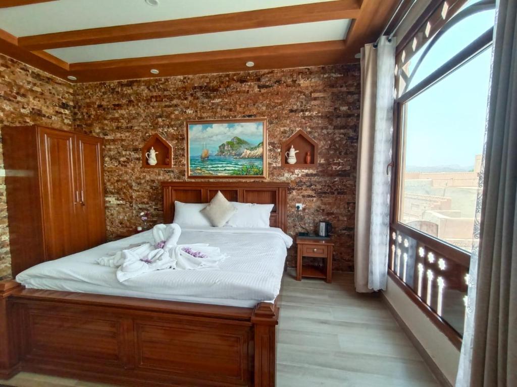 Postel nebo postele na pokoji v ubytování Durrat Nizwa Inn