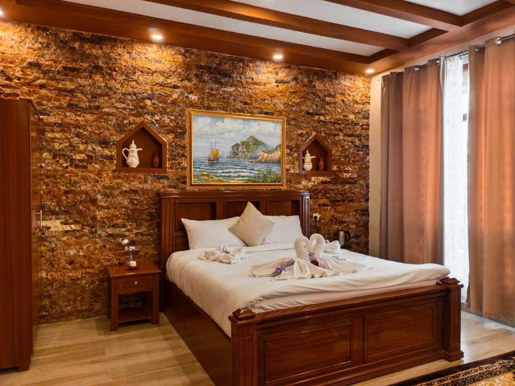 Postel nebo postele na pokoji v ubytování Durrat Nizwa Inn