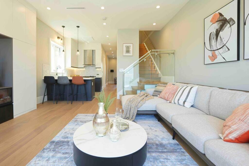 a living room with a couch and a table at Four bedrooms New Lovely Duplex -1626 in Vancouver