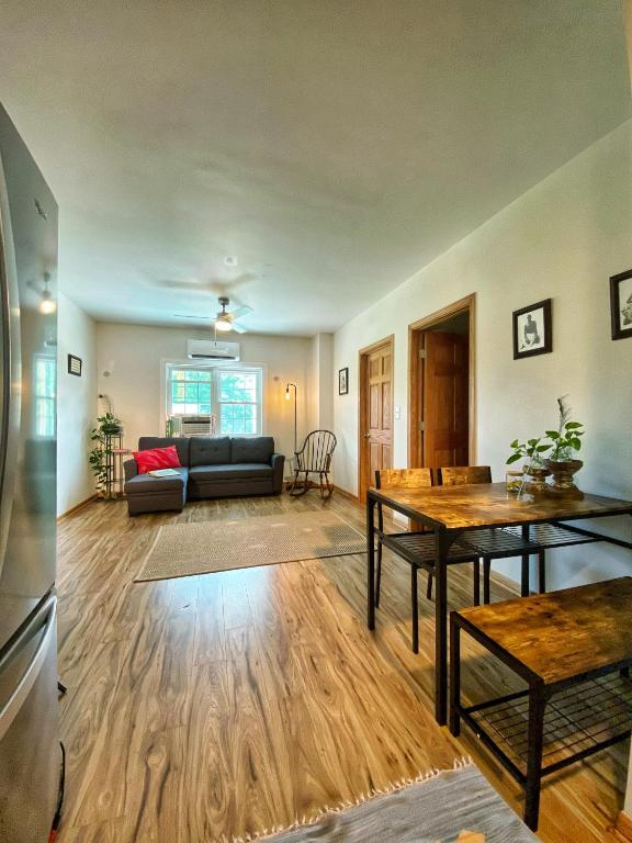 a living room with a couch and a table at Giriraja Ashraya in Moundsville