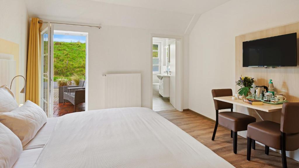 Postel nebo postele na pokoji v ubytování Hotel Deichinsel
