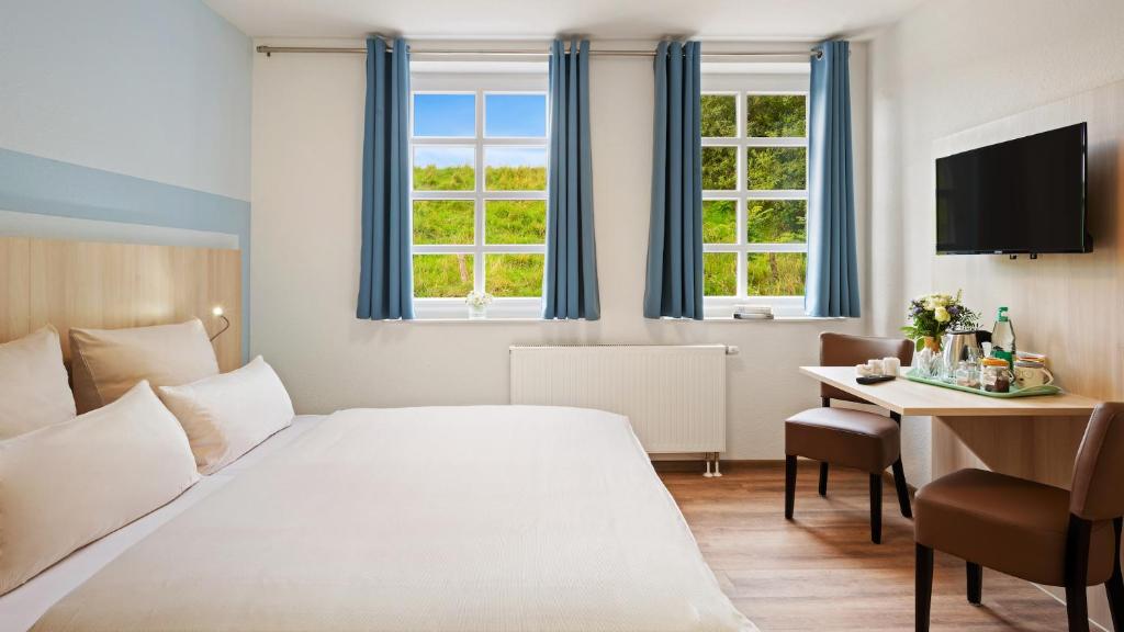 TV a/nebo společenská místnost v ubytování Hotel Deichinsel
