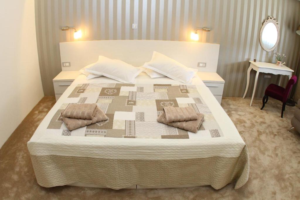 Postel nebo postele na pokoji v ubytování Studio Apartments Mirakul