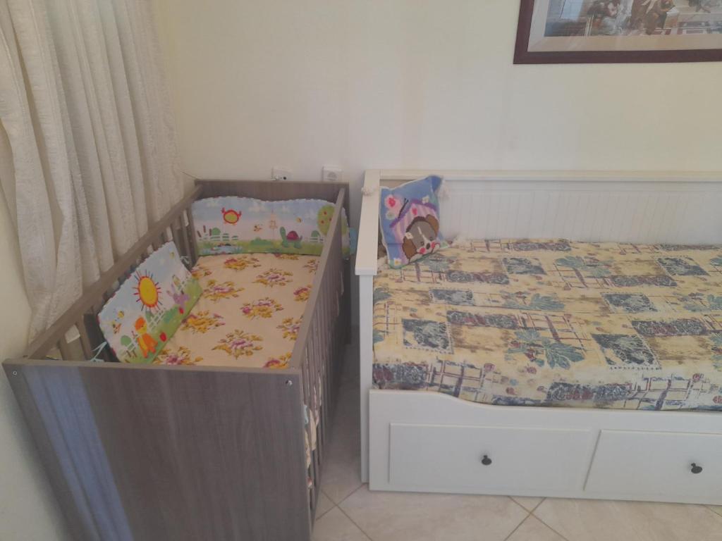 Postel nebo postele na pokoji v ubytování Apartments Giannis