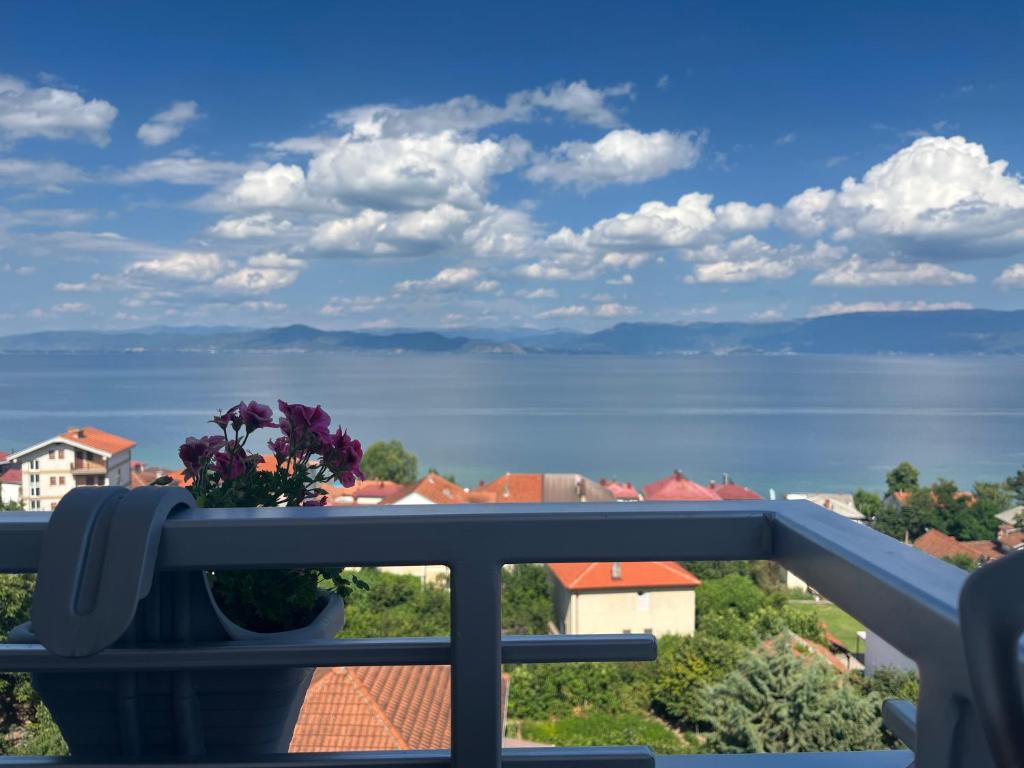 a balcony with a view of the water and buildings at Vila Vista Magica Radozda in Struga