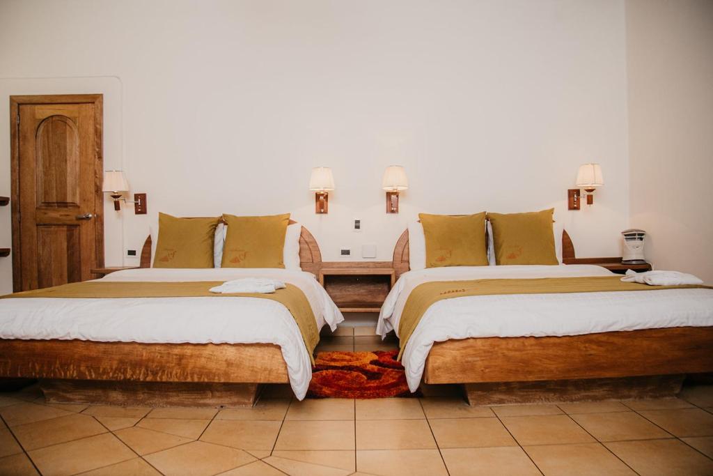 Postel nebo postele na pokoji v ubytování Arahuana Jungle Resort & Spa