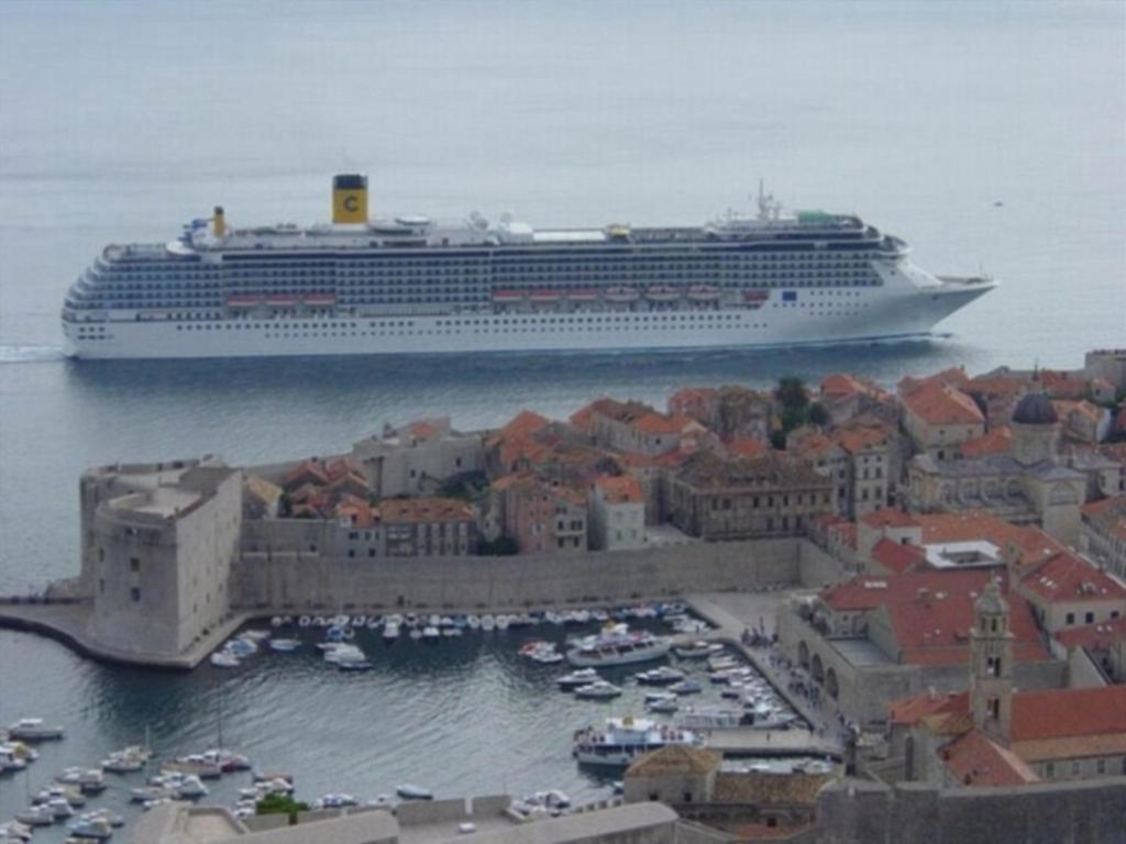a cruise ship is docked in a harbor at Dubrovnik Sea View Apartment in Dubrovnik