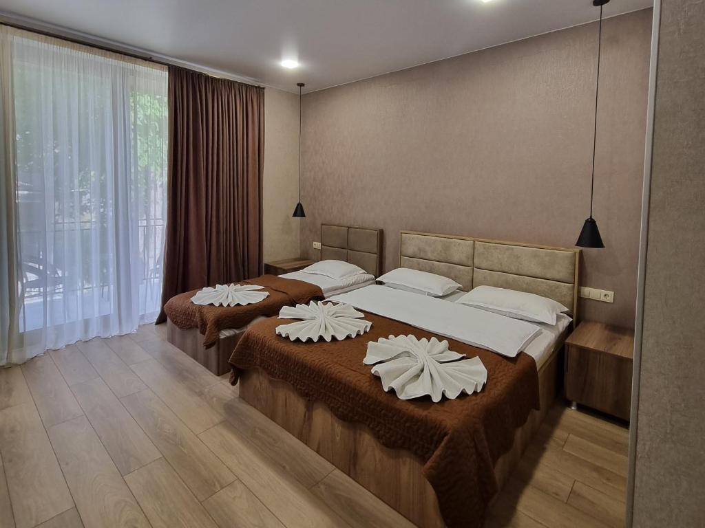 Postel nebo postele na pokoji v ubytování Hotel Sweet Night