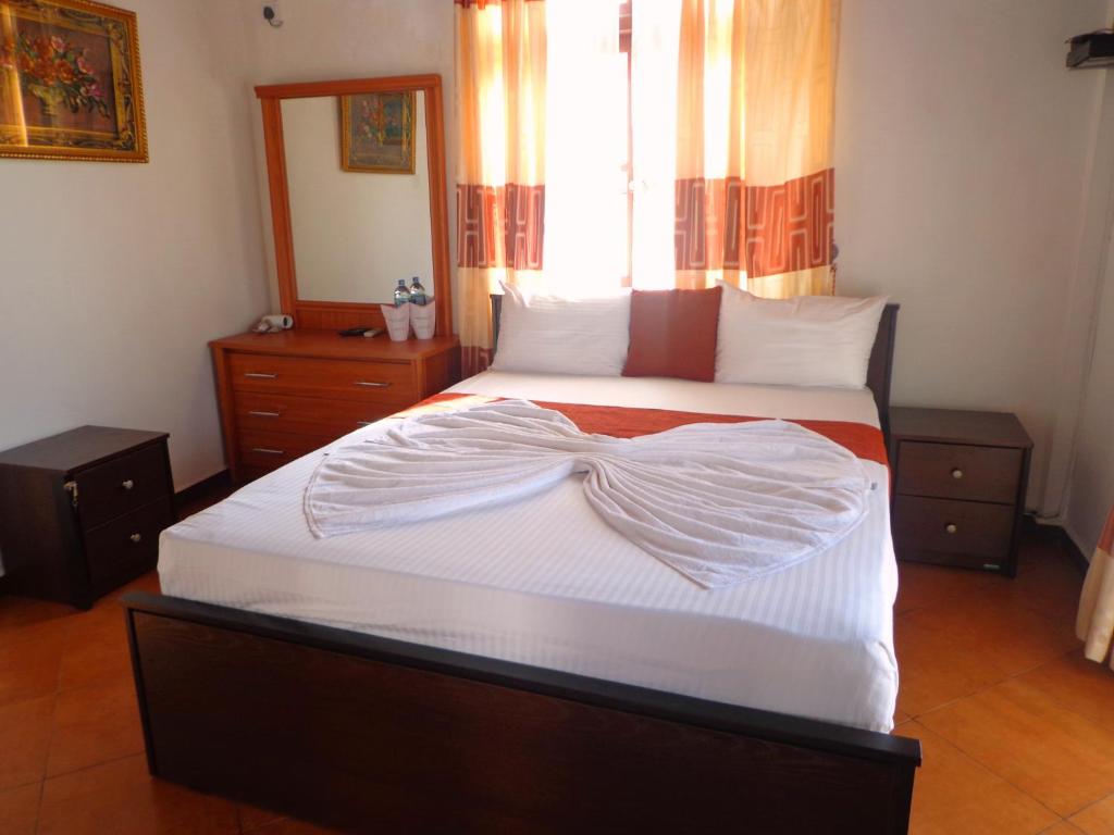 Postel nebo postele na pokoji v ubytování Vino Villa Tourists & Local Accommodations - 24 Hrs
