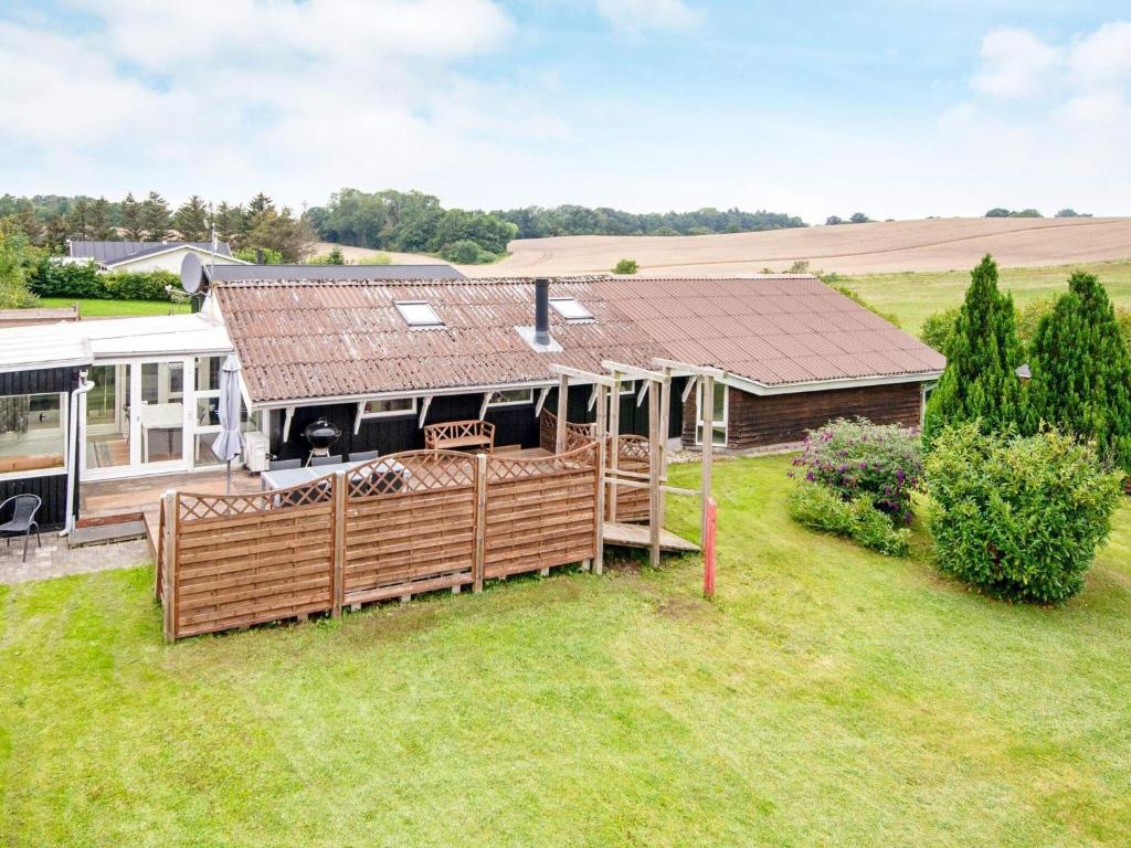 an aerial view of a house with a roof at 6 person holiday home in R nde in Rønde