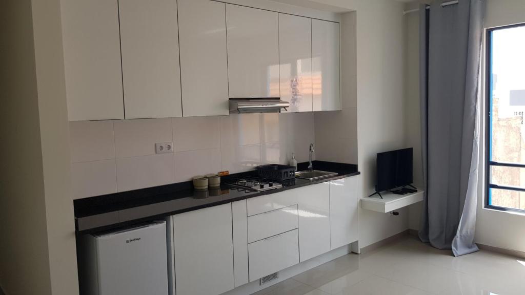 Η κουζίνα ή μικρή κουζίνα στο Apartamentos Beira-Mar