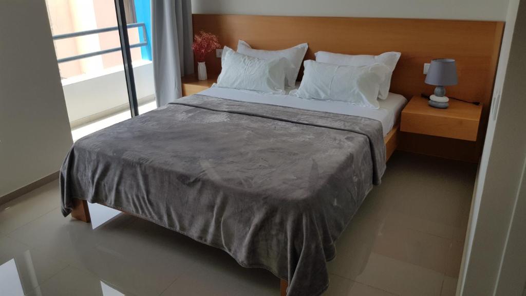 Ένα ή περισσότερα κρεβάτια σε δωμάτιο στο Apartamentos Beira-Mar
