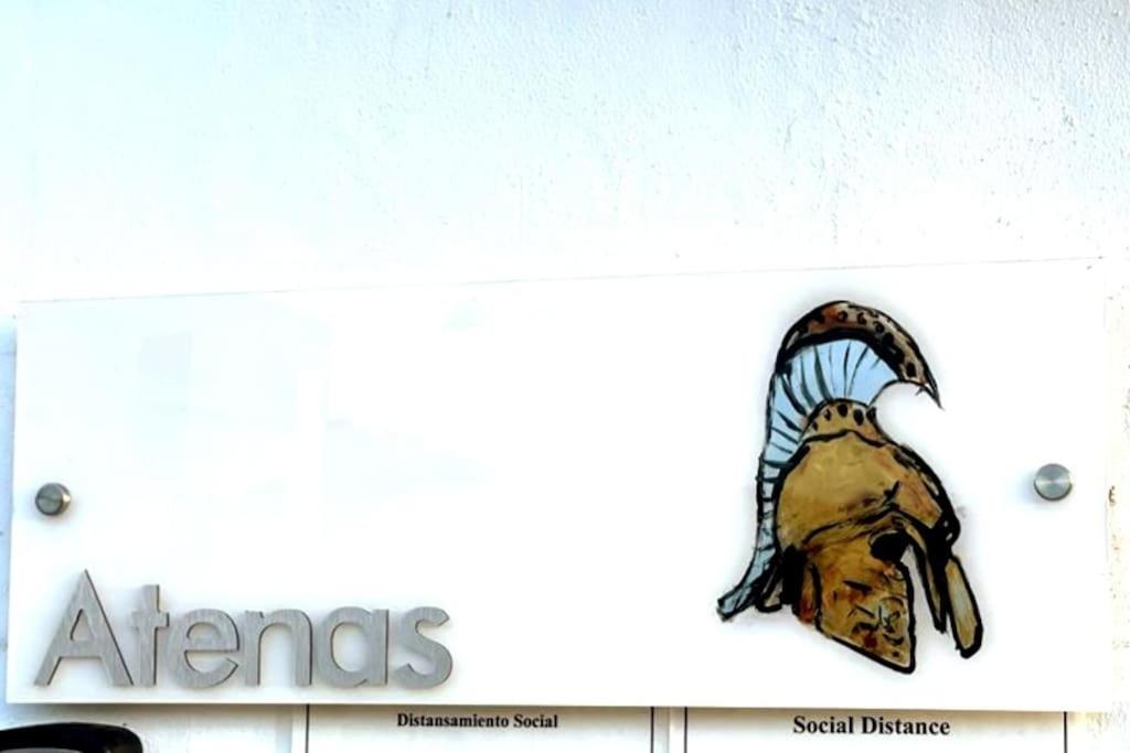 a sign for aries on the side of a building at Casa Carmen Culebra- Atenas in Culebra
