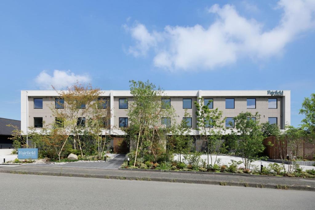 an apartment building on the side of a street at Fairfield by Marriott Fukuoka Ukiha in Ukiha