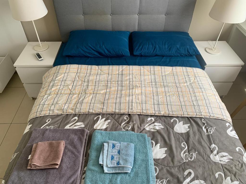 Postel nebo postele na pokoji v ubytování Unixx south pattaya best sea view high floor