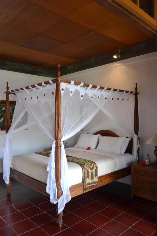 Postel nebo postele na pokoji v ubytování Hotel Bunga Permai