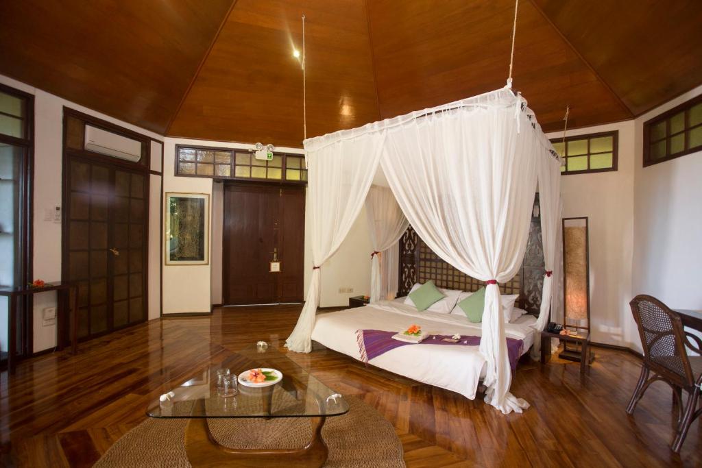 Postel nebo postele na pokoji v ubytování Mandala Spa & Resort Villas