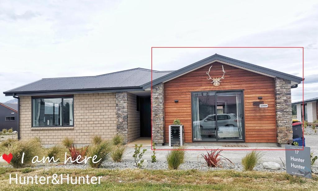 a house with a car in the front yard at Twin Studio on Andrew Don Drive(Without Kitchen) in Lake Tekapo