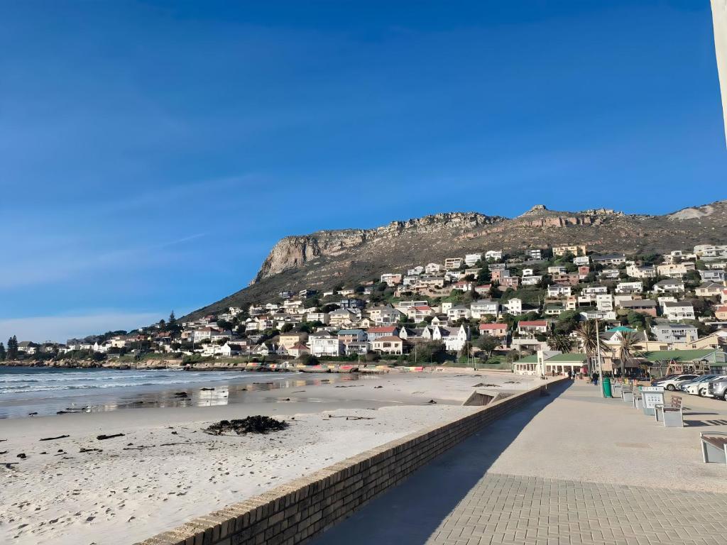 a beach with a bunch of houses on a hill at Back to the 80s in Cape Town