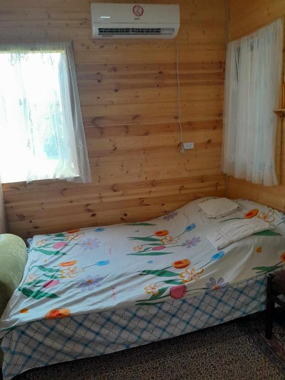 Postel nebo postele na pokoji v ubytování Riverside