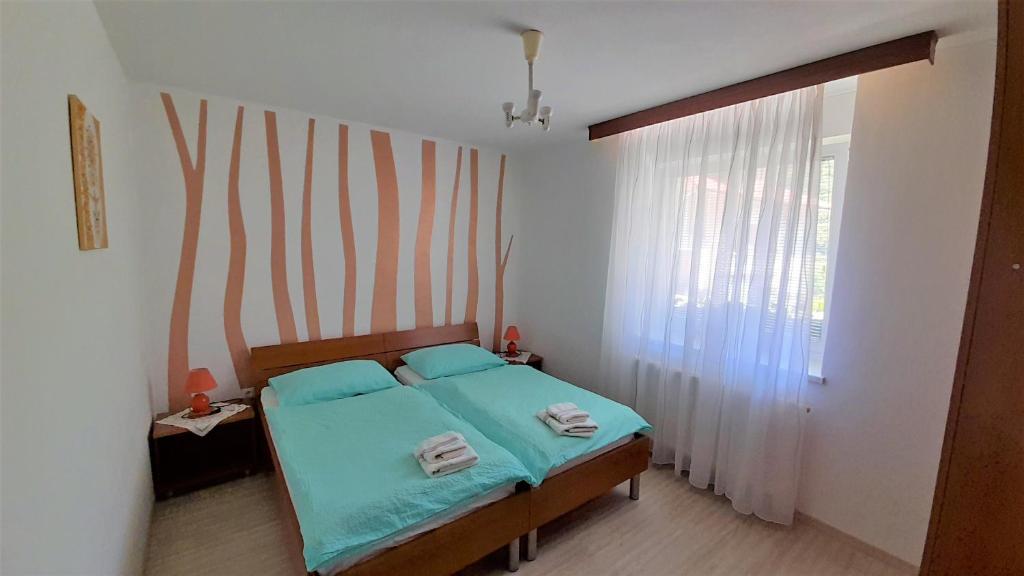 Postel nebo postele na pokoji v ubytování Guesthouse Sobe Silva