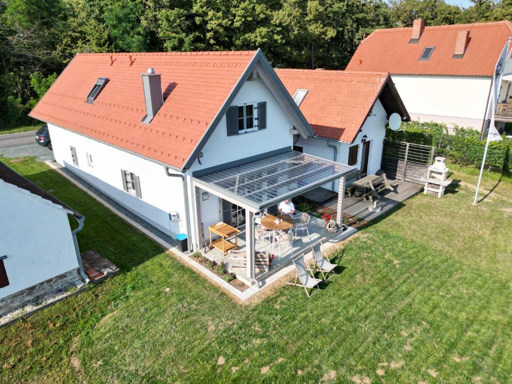 an aerial view of a house with a solarium at Szapary 1620 in Woppendorf