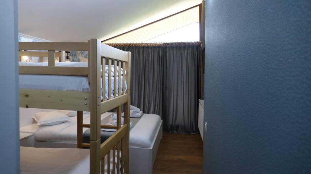 Postel nebo postele na pokoji v ubytování Star Villa Bakuriani