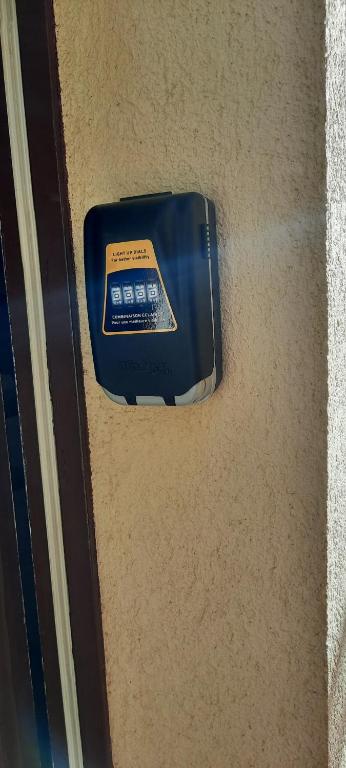 a blue electronic device on the floor of a room at CAP D&#39;AGDE studio cabine 6 pers. + terrasse + parking privé + clim (calme) in Cap d&#39;Agde