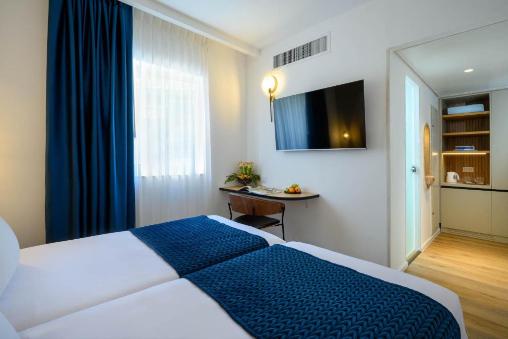 Postel nebo postele na pokoji v ubytování Prima Palace Hotel