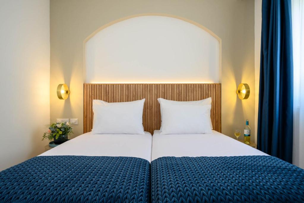 Postel nebo postele na pokoji v ubytování Prima Palace Hotel
