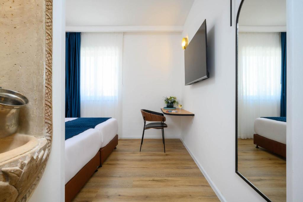 Postel nebo postele na pokoji v ubytování Prima Palace Hotel