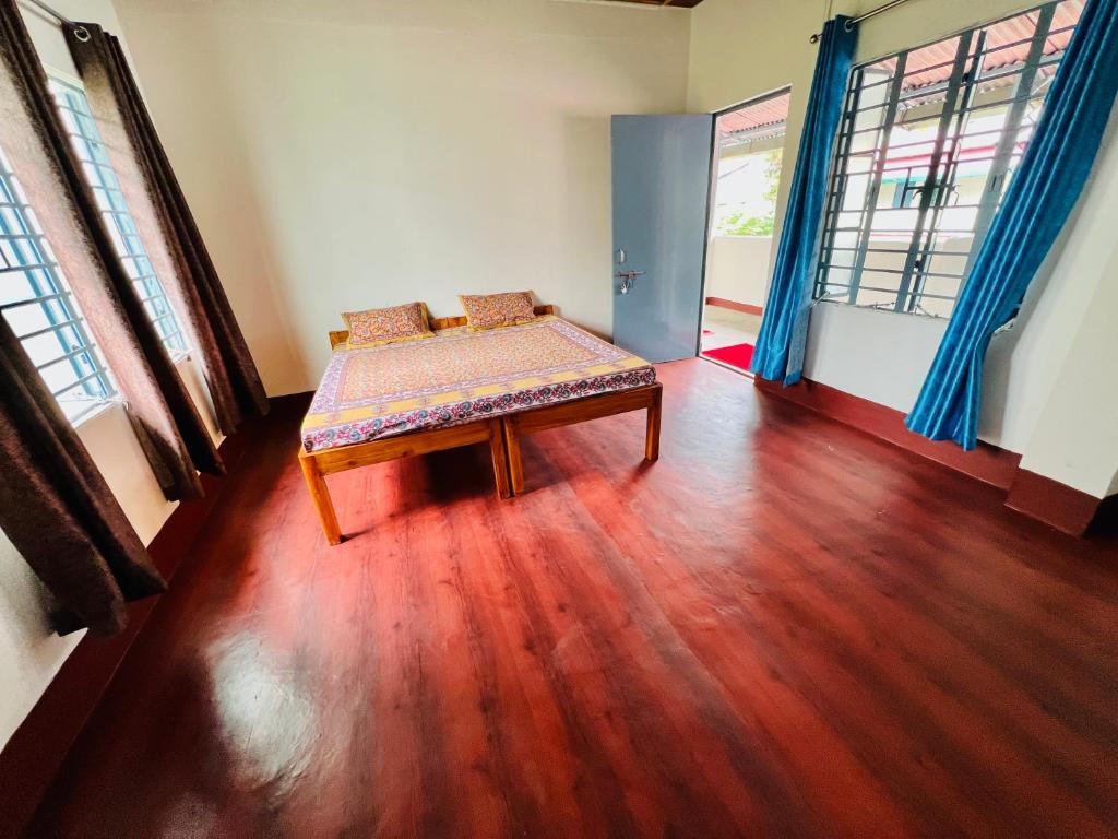 a room with a bench in the middle of a room at Levi Home Guest House & Retreat Centre in Siliguri