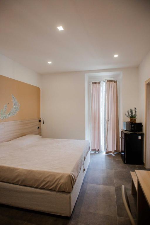 Una cama o camas en una habitación de Domi Home